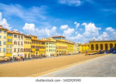 Florence, Italy, September 15, 2018: Row of colorful buildings on Piazza dei Pitti square in historical centre of city, blue sky white clouds, Tuscany