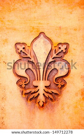 florence lily coat of arms in a rusty metal plate