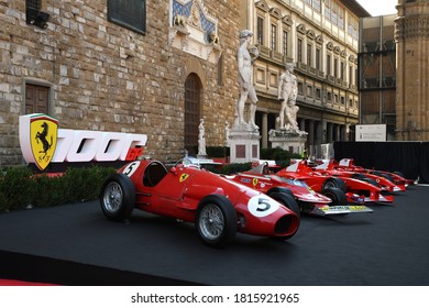 Florence, September 2020: Ferrari 500 F2 F1 of year 1952 and other historic F1 cars on display during the Ferrari 1000 GP Show in Piazza della Signoria in front of Michelangelo's David Statue. Italy.