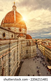 Florence in summer, Italy, Europe. Vertical sunny view of Duomo or Basilica di Santa Maria del Fiore (St Mary of Flower), top landmark of Florence city. Scenery of Florence cathedral in sunset light - Shutterstock ID 2206211481