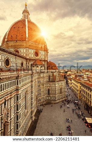 Florence in summer, Italy, Europe. Vertical sunny view of Duomo or Basilica di Santa Maria del Fiore (St Mary of Flower), top landmark of Florence city. Scenery of Florence cathedral in sunset light