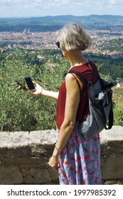 Florence, Tuscany, Italy - 06-25-2021 - Northern European Tourist In Front Of The Panorama Of Florence, From A Pitch In Fiesole