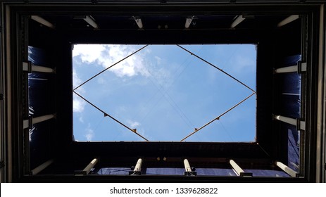 Florence, Tuscany, Italy - March, 2019. View of the sky with clouds from the inner courtyard of Palazzo Strozzi, Florence, Tuscany, Italy