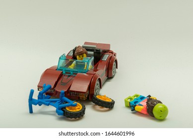 Florianopolis - Brazil, February 2, 2020: Minifigure  Of Cyclist Getting Hit By Sportive Car. Traffic Accident With Injured Biker On The Ground. Minifigures Are Manufactured By The Lego Group.