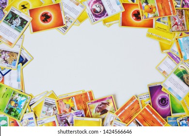 Florianopolis - Brazil, June 13, 2019: Pokemon Cards Distributed On The White Table. Brazilian Youths Perform Battles Using These Collectible Cards.