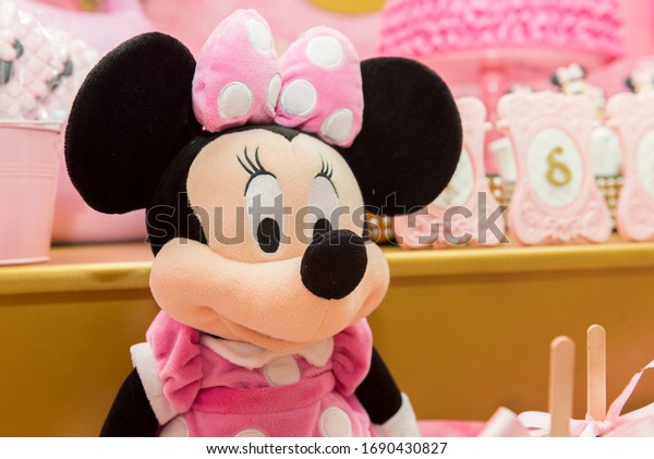 Florianopolis, Brazil - March, 15, 2020: Sweet table decoration in children's party with Minnie Mouse theme. Reception for birthday party. Decoration for girl anniversary party. 