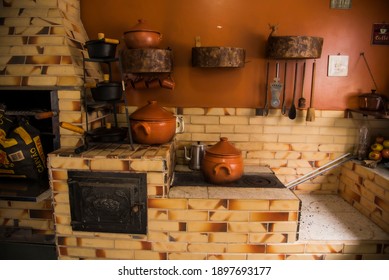 "Florianopolis, Santa Caterina Brasil -June 15 2018: Wooden stove with terracotta pans, Santa Caterina- Brasil"