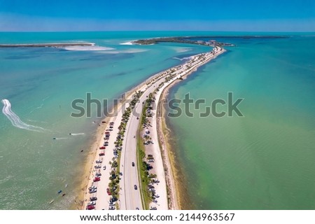 Florida beach. Panorama of Honeymoon Island State Park. Spring or Summer vacations in USA. Dunedin FL Causeway. Blue-turquoise color of salt water. Ocean or Gulf of Mexico. Aerial view. Seascape photo