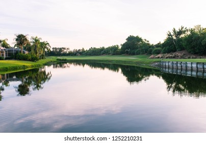 Florida Golf Course Community With Beautiful Reflections At Sunset