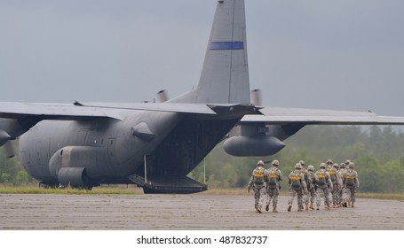 Florida, USA - May 10, 2014: American Army troops deploying on a C-130 Hercules.
