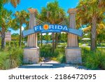 Florida. Florida welcome center in rest area or rest stops for cars and trucks.  FL sunshine state. United States of America. Florida Welcomes You sign. Vacation trip. Palm Trees. Visitor center.