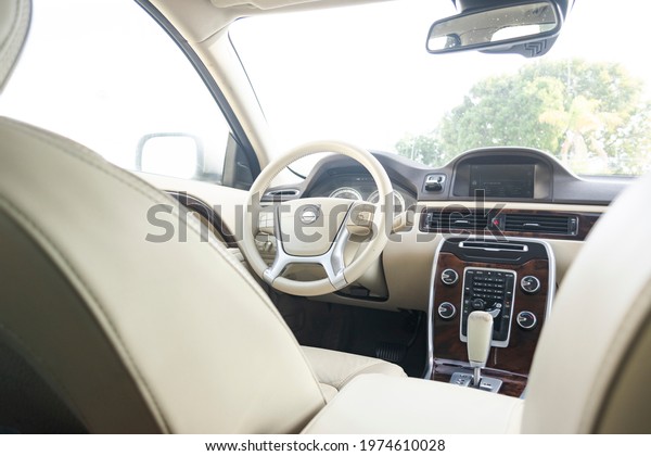 Florida, year 2019: light interior\
of a Volvo Cross Country. Sweden car. Leather and\
dashboard.