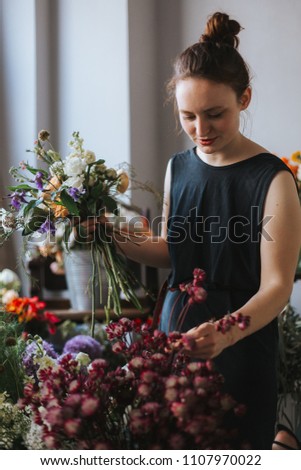 Similar – Foto Bild Floristin bindet einen bunten Strauß Blumen