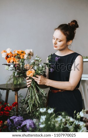 Similar – Foto Bild Floristin bindet einen bunten Strauß Blumen