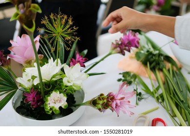 Florist Arranging Flower Bouquet In Vase. People In Floristry Class Course Workshop