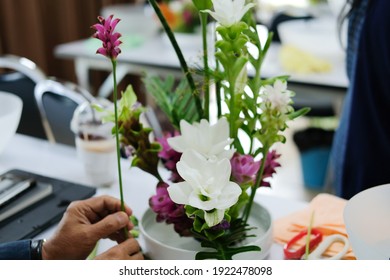 Florist Arranging Flower Bouquet In Vase. People In Floristry Class Course Workshop