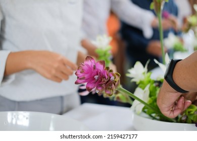 Florist Arranging Flower Bouquet In Vase. People In Floristry Class Course Workshop