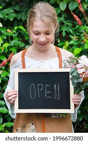 Florist Holding An Open Board Sign Mockup