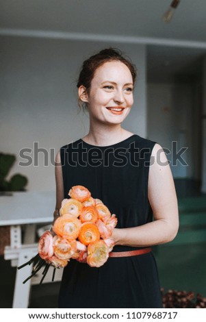 Image, Stock Photo Young smiling florist with a bouquet of ranunculus