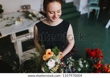 Similar – Foto Bild Floristin bindet einen bunten Strauß Blumen