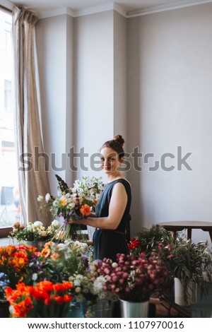 Similar – Foto Bild Floristin bindet einen bunten Strauß Blumen