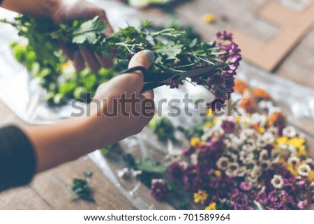 Similar – Hands make bouquet in vase