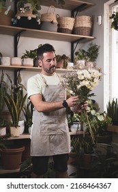 A Florist Man Making A Bouquet Of Flowers For An Order.own Business