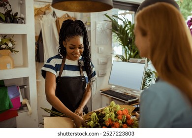 Florist preparing bouquet for customer at flower shop - Powered by Shutterstock