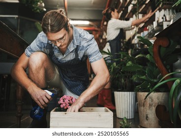 Florist, spray water and flowers or plants in garden, nursery and sustainable greenhouse for boutique store. Gardening, small business and eco friendly people for botanical, horticulture or retail - Powered by Shutterstock