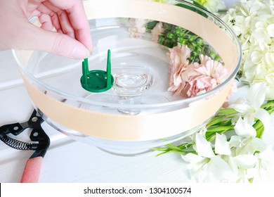 Florist At Work. How To Make Floral Decorations On Summer Party Table. Centerpiece With Rose, Dahlia And Hortensia Flowers. White Plates, Table Cloth, Romantic Wedding Reception. Step By Step, Diy. 