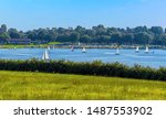 A flotilla of sailing boats on Rutland Water reservoir in summertime