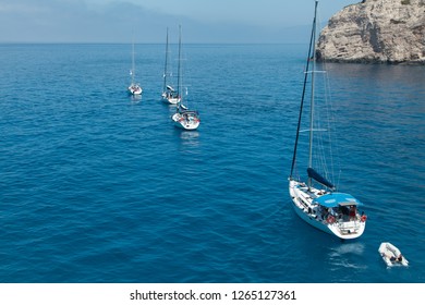 A Flotilla Of Sailing Yachts Out Of The Bay.