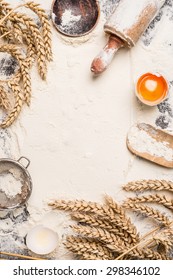 Flour Baking Background With Raw Egg, Rolling Pin And Wheat Ear , Top View