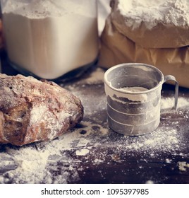 Flour And Bread On A Messy Kitchen Top