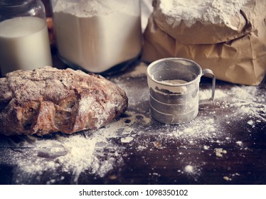 Flour And Bread On A Messy Kitchen Top