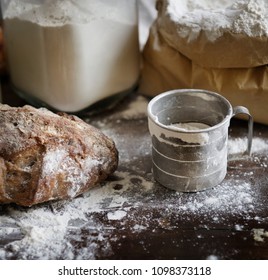 Flour And Bread On A Messy Kitchen Top