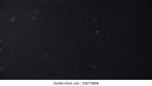 flour dust particles on black background, motion blur - Shutterstock ID 328774808