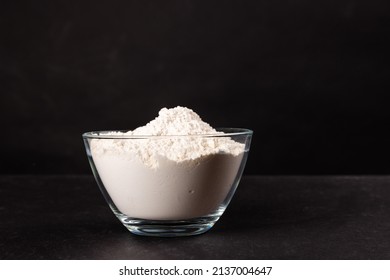 Flour In A Glass Bowl With Black Background