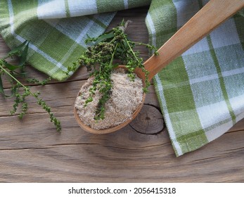 Flour, Grits In A Wooden Spoon,  Grass Garden Orach With Seeds On A Wooden Table,  Flat Layout. Medicinal Plant Atriplex Hortensis For Use In Dietary And Vegetarian Nutrition, Natural Gluten-free Food