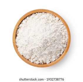 Flour in a wooden bowl set against a white background. View from above - Shutterstock ID 1932738776