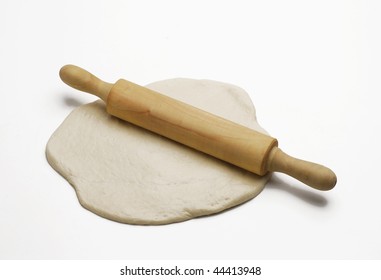 Floured Rolling Pin On Pizza Dough.