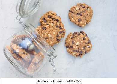 Flourless Gluten Free Peanut Butter, Oatmeal And Chocolate Chips Cookies In Glass Jar, Top View, Horizontal