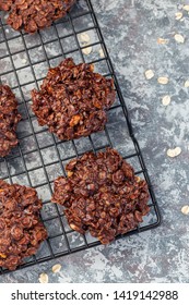 Flourless No Bake Peanut Butter And Oatmeal Chocolate Cookies On A Cooling Rack, Vertical, Top View