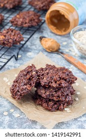 Flourless No Bake Peanut Butter And Oatmeal Chocolate Cookies On Parchment, Vertical