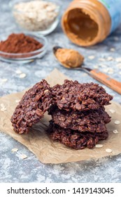 Flourless No Bake Peanut Butter And Oatmeal Chocolate Cookies On A Parchment, Vertical