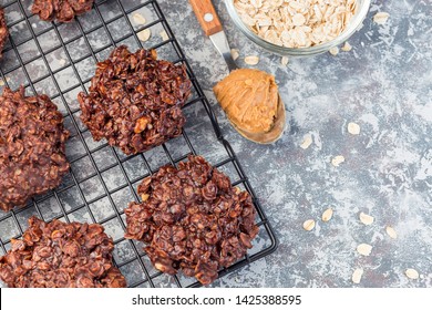 Flourless No Bake Peanut Butter And Oatmeal Chocolate Cookies On A Cooling Rack, Horizontal, Top View, Copy Space