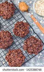 Flourless No Bake Peanut Butter And Oatmeal Chocolate Cookies On A Cooling Rack, Vertical, Top View