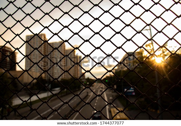 \
the flow\
of moving cars through a metal mesh cube urban landscapes wallpaper\
city road with cars through the\
mesh
