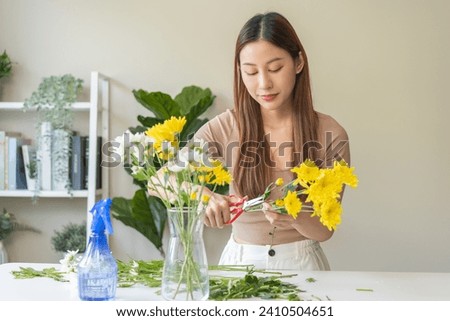 Similar – Image, Stock Photo Woman prepares a bouquet of red roses