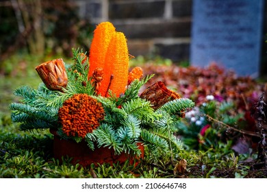 A Flower Arrangement On A Grave Site.